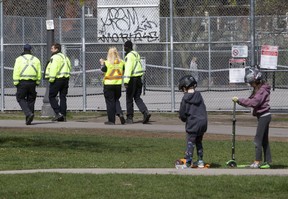 City bylaw enforcement officers in Trinity Bellwoods Park don’t appear to be following the social distancing protocols they are there to enforce on Thursday, May 7, 2020.