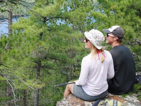 A couple enjoys the view in the Cliff Lake Conservation Reserve, a nearly 3,000 hectare jewel in the Temagami area.