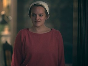 This supplied photo features Elisabeth Moss from a scene in the Handmaid's Tale.
