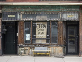 A storefront with the message "CEBA won't save us", along Dundas St. W., near Roncesvalles Ave. Toronto, Ont on Thursday April 23, 2020.  This is referring to the Canada Emergency Business Account.