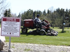 The maintenance crew prepares Carruthers Creek Golf & Country Club on May 13, 2020.