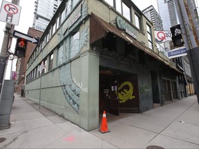 The famous Crocodile Rock bar on Adelaide St. W. at Duncan that's has been an institution for almost three decades has shuttered its doors because of COVID. Signs on the doors explain COVID has closed them. A group of worker's were removing items like the stereo system and other items at the owner's behest in Toronto, Ont. on Tuesday May 12, 2020.