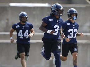 Argonauts defensive back Alden Darby Jr. (centre) is a man of many talents. (Jack Boland/Toronto Sun)