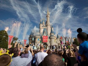 Fireworks go off around Cinderella's castle during the grand opening ceremony for Walt Disney World's new Fantasyland in Lake Buena Vista, Fla., on Dec. 6, 2012.