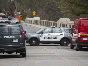 Police closed off the bridge along Glen Rd, at South Dr. following a fire under the bridge in Toronto, Ont. on Friday, May 1, 2020.