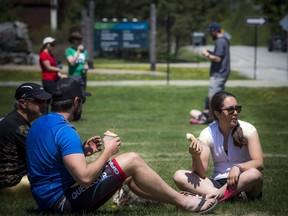 People were out enjoying the sunshine in the park area near the Gatineau Park Visitor Center, north of Gatineau, Que., Saturday, May 23, 2020.