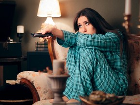 Girl Wearing Pajamas Watching TV in her Room