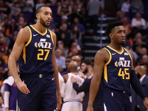 Rudy Gobert, left, and Donovan Mitchell of the Utah Jazz during the first half of the NBA game against the Phoenix Suns at Talking Stick Resort Arena on Oct. 28, 2019 in Phoenix, Ariz.