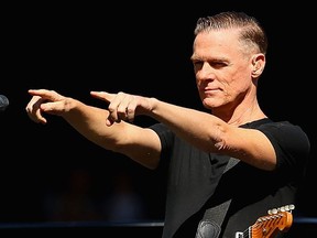 MELBOURNE, AUSTRALIA - OCTOBER 03:  Bryan Adams performs during the 2015 AFL Grand Final match between the Hawthorn Hawks and the West Coast Eagles at Melbourne Cricket Ground on October 3, 2015 in Melbourne, Australia.  (Photo by Quinn Rooney/Getty Images)