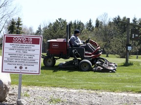 The maintenance crew prepares Carruthers Creek Golf & Country Club for opening on Wednesday, May 13, 2020.