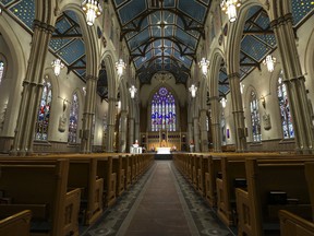 Roman Catholic Cardinal Thomas Colllins presides over Good Friday mass at St, Michael's Cathedral Basilica on Bond St. To and empty church on Good Friday on Friday April 10, 2020.