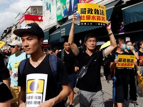 Anti-parallel trading protesters shout slogans during a march at Sheung Shui, a border town in Hong Kong, China July 13, 2019.