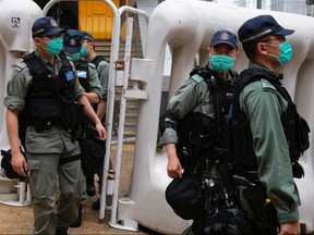 Riot police are seen during a march against new security laws, near China's Liaison Office, in Hong Kong, May 22, 2020.