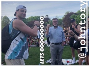 Social media image of Toronto Mayor John Tory at Trinity Bellwoods Park on Saturday, standing less than six feet from others and wearing his facemask around his neck — an act Toronto top doctor Eileen de Villa specifically advised against earlier this week. Tory has since apologized.