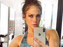 Jennifer Lopez's gym selfie went viral after fans spotted a masked man in the background. 