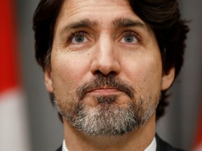 Canada's Prime Minister Justin Trudeau pauses during a news conference on Parliament Hill in Ottawa on May 1, 2020.