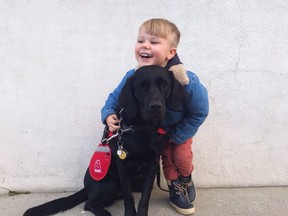 Little Jones with his dog, Cynder.