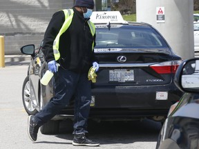A company called Indigo comes around to each limo and sprays and cleans out the rear passenger areas after as limo drivers park for fares in the limo parking lot outside of Terminal 3 at Pearson International Airport. Several drivers have tested positive from COVID-19 and close to 10 have apparently died. Many drivers are worried to pick up fares while others weather it out for one or two a day.
