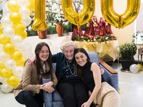 Mickey Pollard celebrates her 100th birthday with her granddaughters.