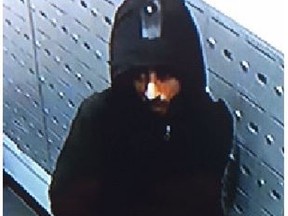 An image released of a suspect sought in the theft of mail from a condo building in the Queen St. W. and Ossington Ave. area on May 4, 2020.