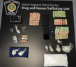 A drug trafficking investigation in Oakville led to three arrests and the seizure of an assortment of drugs and cash.