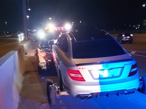 OPP Highway Safety Division posted this image on Twitter of a car being impounded after a 19-year-old driver was allegedly caught speeding on the QEW, near Burlington.