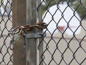 A tennis and basketball court in the northwest corner of the city remains locked as the Toronto Raptors get set to gain access to their courts on Friday, May 8, 2020.