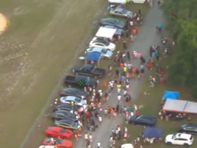 Screengrab of aerial footage showing 3,000 revelers in the streets in Southwest DeLand at a memorial block party.