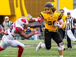 Dion Pellerin, rushing the ball for the Waterloo Warriors, was a fifth-round pick of the Argonauts.