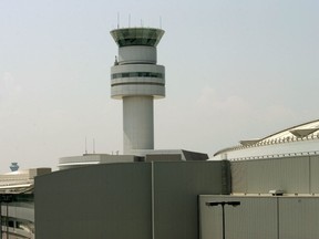 The air traffic control tower at Toronto Pearson International Airport .