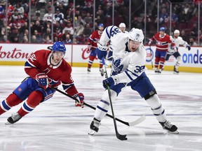 A players such as Maple Leafs defenceman Rasmus Sandin (right), seen here carrying the puck against Jonathan Drouin of the Montreal Canadiens, has been skating in Sweden during the coronavirus pandemic, and isn't likely to be in a rush to return to Toronto to skate with his teammates.