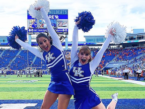 Unidentified members of the University of Kentucky cheerleading squad do their thing.