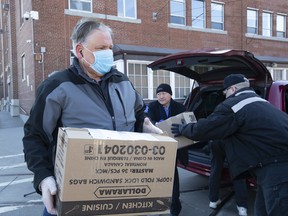 Ward 22 Councillor Jim Karygiannis joins Richard Leary, CEO of the TTC & Carlos Santos, President, Amalgamated Transit Union Local 113 , delivering 13,000 donated masks for TTC workers,  to the TTC Hillcrest Yards on Bathurst Street in Toronto,  Wednesday April 22, 2020. Stan Behal/Toronto Sun/Postmedia Network