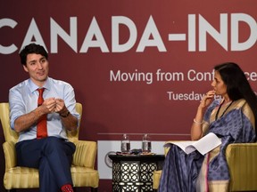 Prime Minister Justin Trudeau (lefg) speaks during a business summit in Mumbai on Feb. 20, 2018.