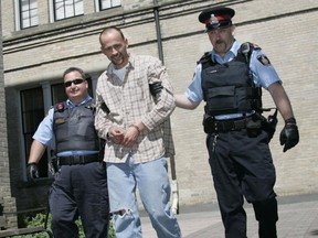 Marc Vickers, who is currently serving life in prison for the 2008 murder of 33-year-old Michelle Barnoski in Warkworth, is seen here being led to Cobourg court on Dec.15, 2010.