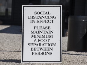 A physical distancing sign at Webers burger stand on Highway 11 in Orillia on Tuesday May 5, 2020.