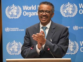 World Health Organization Director-General Tedros Adhanom Ghebreyesus applauds while delivering a speech at the opening of the World Health Assembly virtual meeting from the WHO headquarters in Geneva.