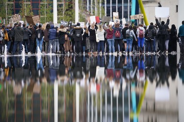 Protesters hold signs during a Black Lives Matter demonstration at Centenary Square on June 4, 2020 in Birmingham, United Kingdom. The death of an African-American man, George Floyd, while in the custody of Minneapolis police has sparked protests across the United States, as well as demonstrations of solidarity in many countries around the world.