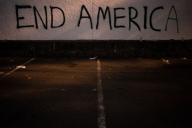 SEATTLE, WA - JUNE 08: Graffiti is seen on a wall after demonstrators clashed with law enforcement near the Seattle Police Departments East Precinct shortly after midnight on June 8, 2020 in Seattle, Washington. Earlier in the evening, a suspect drove into the crowd of protesters and shot one person, which happened after a day of peaceful protests across the city. Later, police and protestors clashed violently during ongoing Black Lives Matter demonstrations following the death of George Floyd.