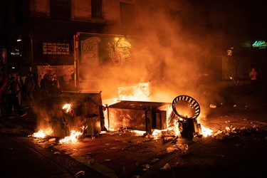SEATTLE, WA - JUNE 08: A fire burns in the street after demonstrators clashed with law enforcement near the Seattle Police Departments East Precinct shortly after midnight on June 8, 2020 in Seattle, Washington. Earlier in the evening, a suspect drove into the crowd of protesters and shot one person, which happened after a day of peaceful protests across the city. Later, police and protestors clashed violently during ongoing Black Lives Matter demonstrations following the death of George Floyd. (Photo by David Ryder/Getty Images)