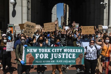 NEW YORK, NY - JUNE 08:  People protest at One Police Plaza on June 8, 2020 in New York City. More than 500 former and current mayor's office staff joined with city agency staff to demand policy reforms on the NYPD amid the nation-wide protests against police brutality and racial inequality.  (Photo by Stephanie Keith/Getty Images)