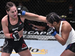 In this handout image provided by UFC, Cynthia Calvillo, right, punches Jessica Eye in their flyweight fight during the UFC Fight Night event at UFC APEX on June 13, 2020 in Las Vegas, Nevada.