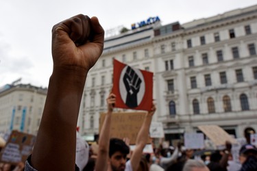 A protester raises a fist during a Black Lives Matter march on June 04, 2020 in Vienna, Austria. The death of an African-American man, George Floyd, while in the custody of Minneapolis police has sparked protests across the United States, as well as demonstrations of solidarity in many countries around the world.