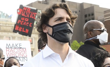 Prime Minister Justin Trudeau takes part in an anti-racism protest on Parliament Hill during the COVID-19 pandemic in Ottawa on Friday, June 5, 2020.