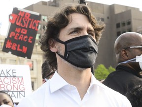 Prime Minister Justin Trudeau takes part in an anti-racism protest on Parliament Hill during the COVID-19 pandemic in Ottawa on Friday, June 5, 2020.