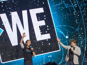Craig Kielburger and his brother Marc Kielburger (R) take to the stage as WE Day takes place at Canadian Tire Centre in Ottawa to unite young change-makers with world-renowned speakers and performers.