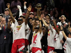 Toronto Raptors guard Kyle Lowry (right) celebrates with the Larry O'Brien Championship Trophy after defeating the Golden State Warriors for the NBA Championship in game six of the 2019 NBA Finals at Oracle Arena.
