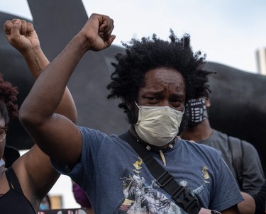 Tristen Taylor a protest organizer crys during a peaceful demonstration over the death of George Floyd, in Detroit, Michigan, June 3,2020 - The Chief of Detroit Police James Craig later ended the curfew after protesters called for an end to the curfew.
