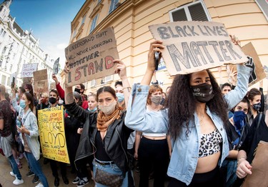 Protestors attend a Black Lives Matter march in Vienna, Austria, on June 4, 2020, in solidarity with protests raging across the United States over the death of George Floyd, an unarmed black man who died during an arrest on May 25.