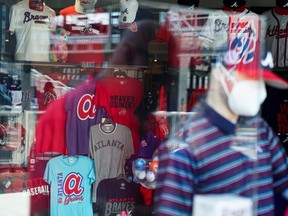 The logo of the Braves is seen on merchandise at the team's official store at Truist Park, in Atlanta, Saturday, June 20, 2020.